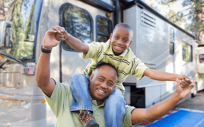 Happy Family in Front of an RV
